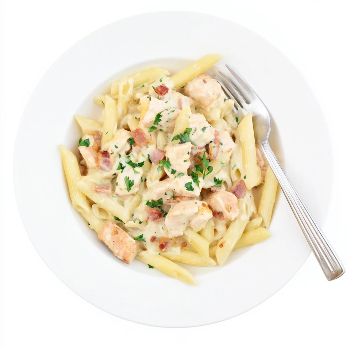Steaming Creamy Chicken Bacon Penne glistens with rich garlic-Parmesan sauce and crispy bacon bits.  
