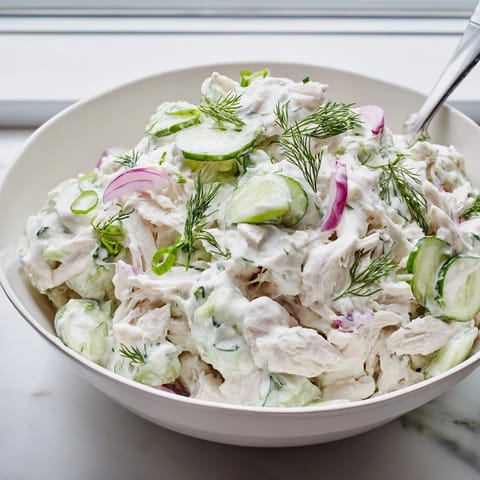 Close-up of Creamy Cucumber Chicken Salad featuring tender chicken chunks and cool cucumbers in a creamy Greek yogurt dressing.