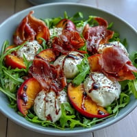 Vibrant Peach Burrata Prosciutto Salad with juicy peaches and creamy burrata.